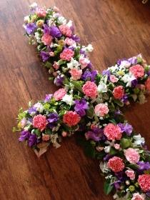 Casket cross in pinks and mauves